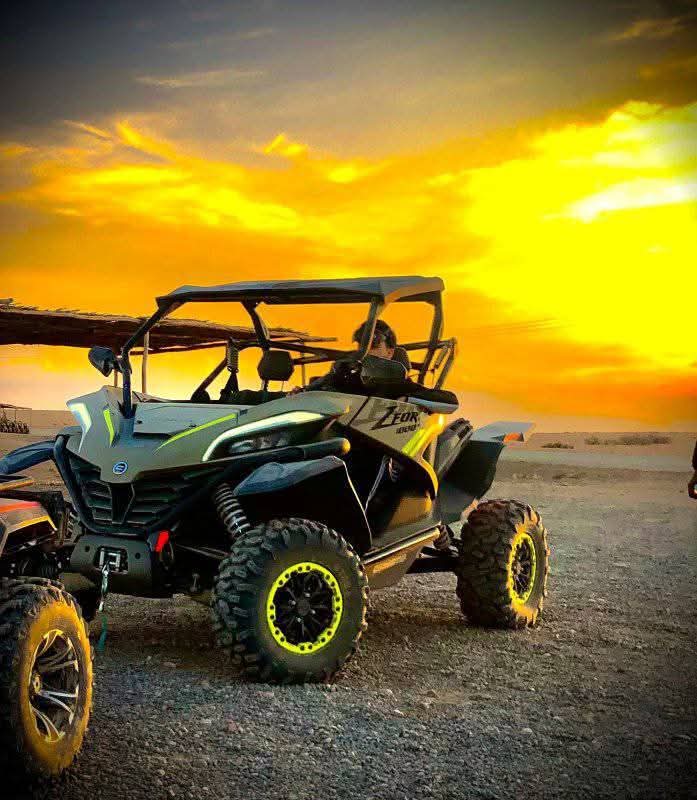 Buggy vehicle at dramatic sunset